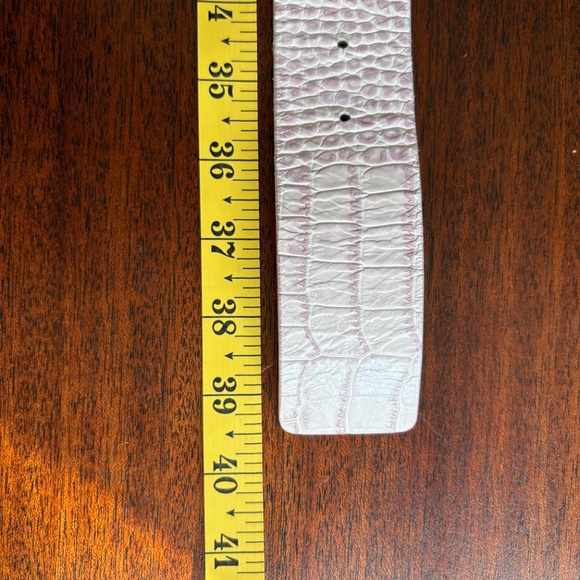 B-Low the belt.Small pink leather.